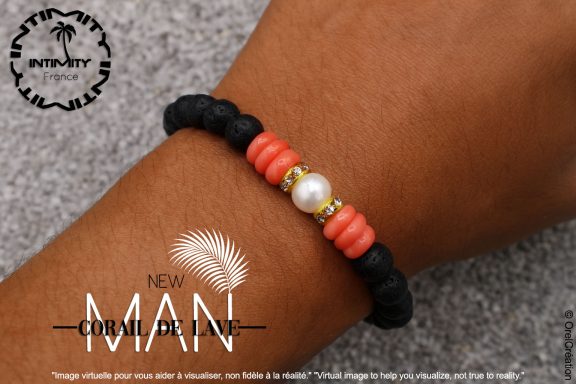 Corail de Lave Bracelet en perles noires avec perles orange et une perle blanche au centre.